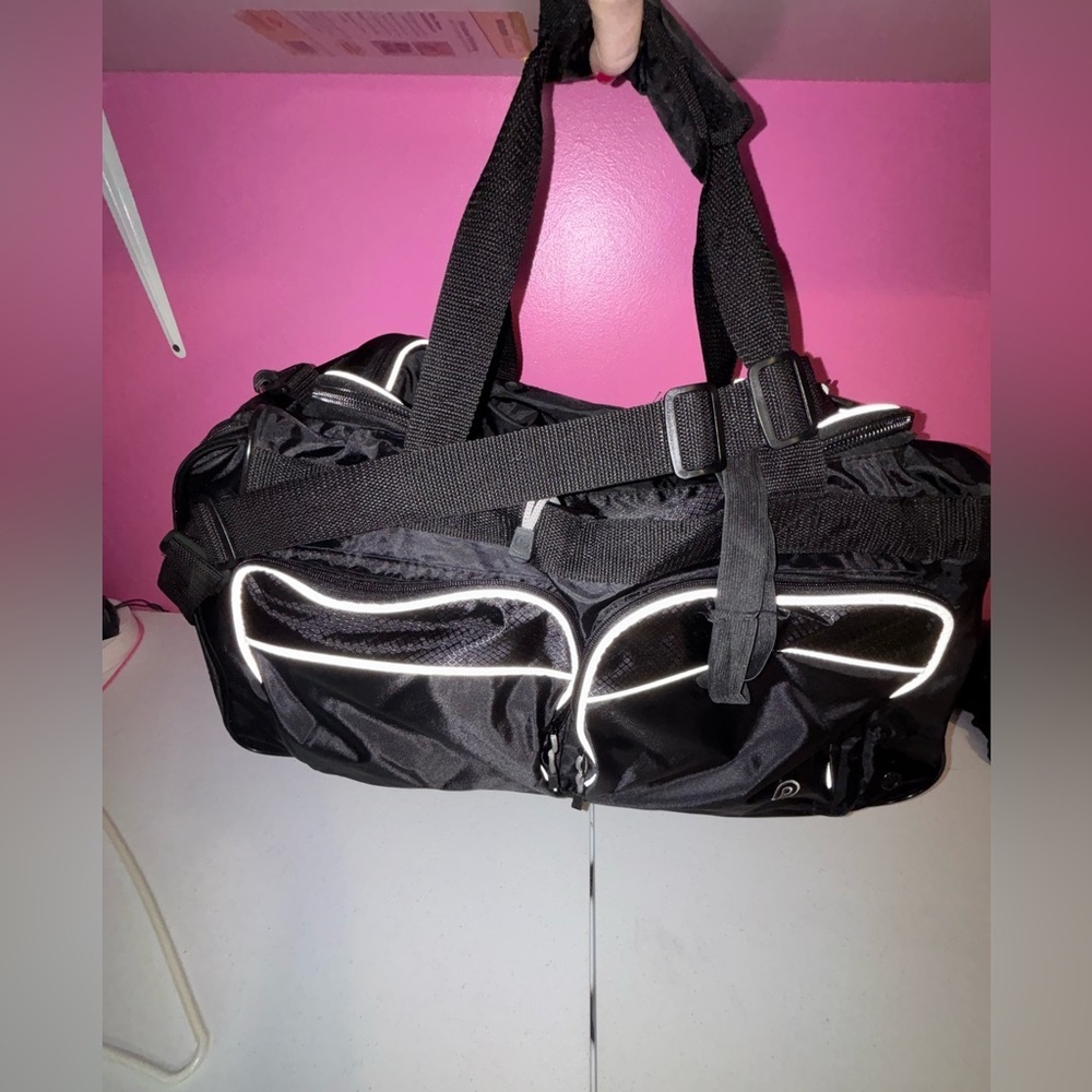Black Duffel Bag with White Accents and Modern Design